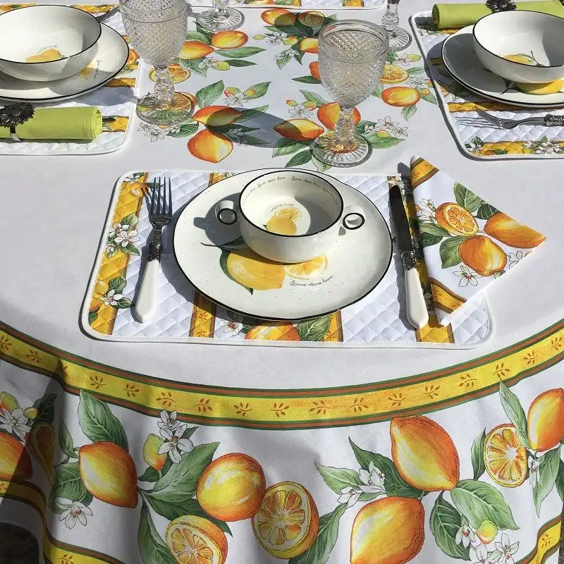 nappe-provencale-ronde-en-coton-citrons-ecru-et-jaune-tissus-toselli-1